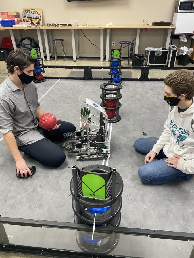 Juniors Keegun Yancey, left, and Jason Fortenberry test their robot in Mrs. Avery’s afterschool robotics program. 